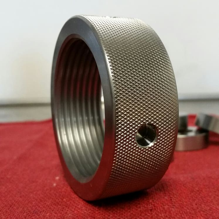 Knurled stainless ring with internal threads